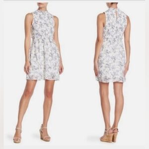 2137) Kenedik Dobby Ditsy White Floral print  Smocked Ruffle Mini Dress Size XS